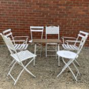 A collection of folding garden chairs