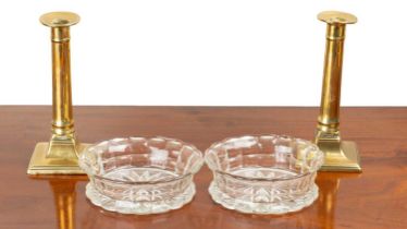 A pair of Regency bottle coasters and a pair of candlesticks