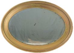 An antique oval gilt hanging wall mirror