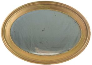 An antique oval gilt hanging wall mirror