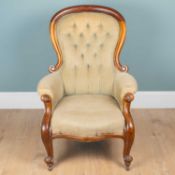 A Victorian walnut-framed armchair