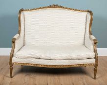 An antique French-style two-seater sofa