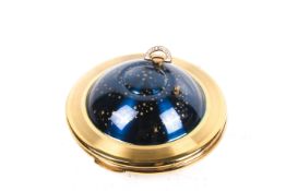 A Kigu 'Flying Saucer' musical powder compact.