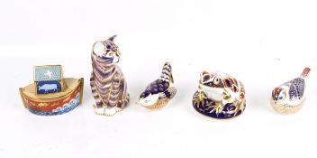 A group of five assorted Royal Crown Derby paperweights.