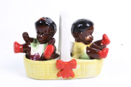 A vintage novelty ceramic salt and pepper shaker set.