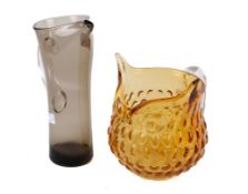 Two pieces of 20th century glassware. Comprising an orange jug modelled as an owl, H17.