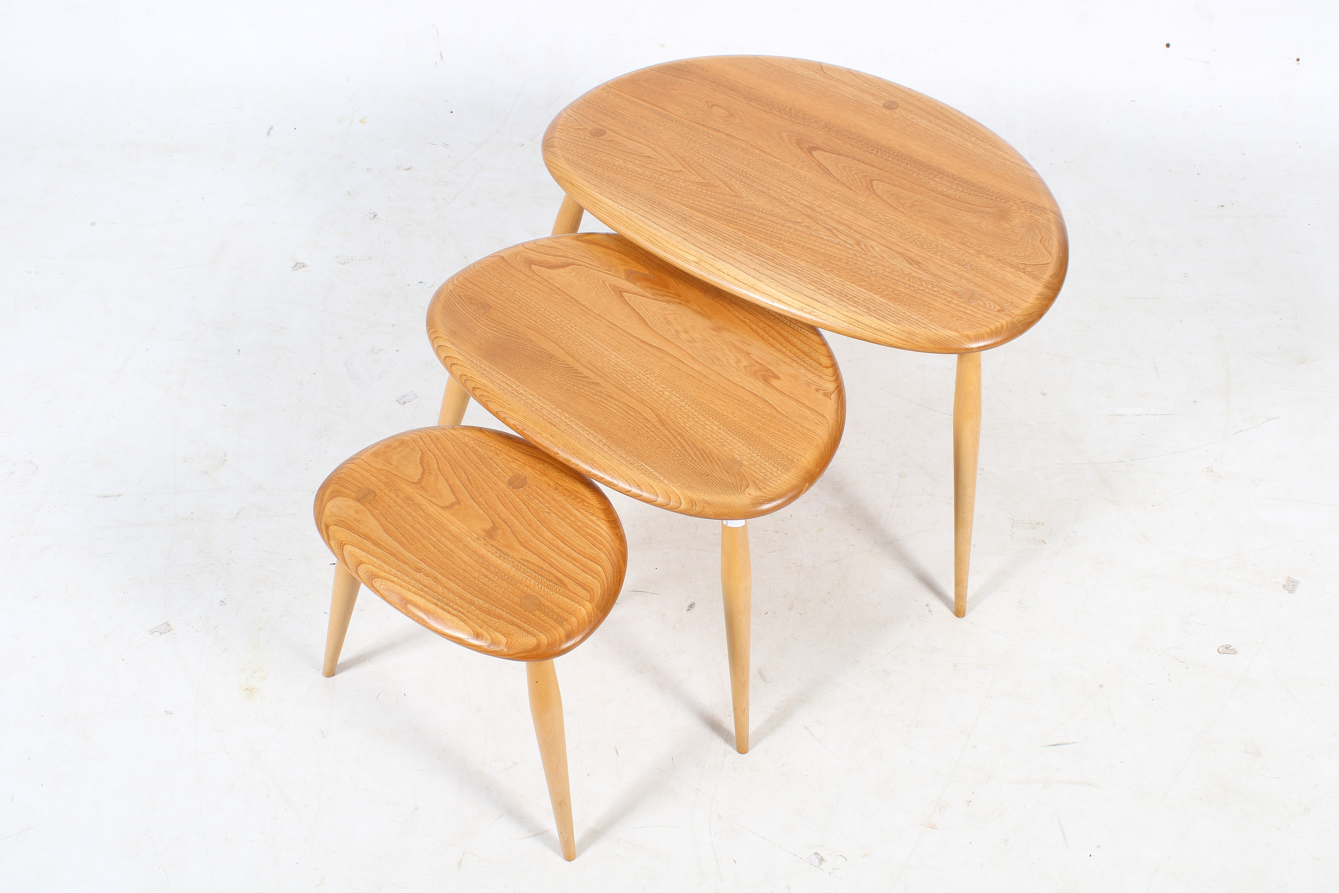 A mid-century Ercol blonde beech and elm nest of tables. - Image 2 of 3