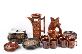 Two mid-century tea services and a gluggle jug.