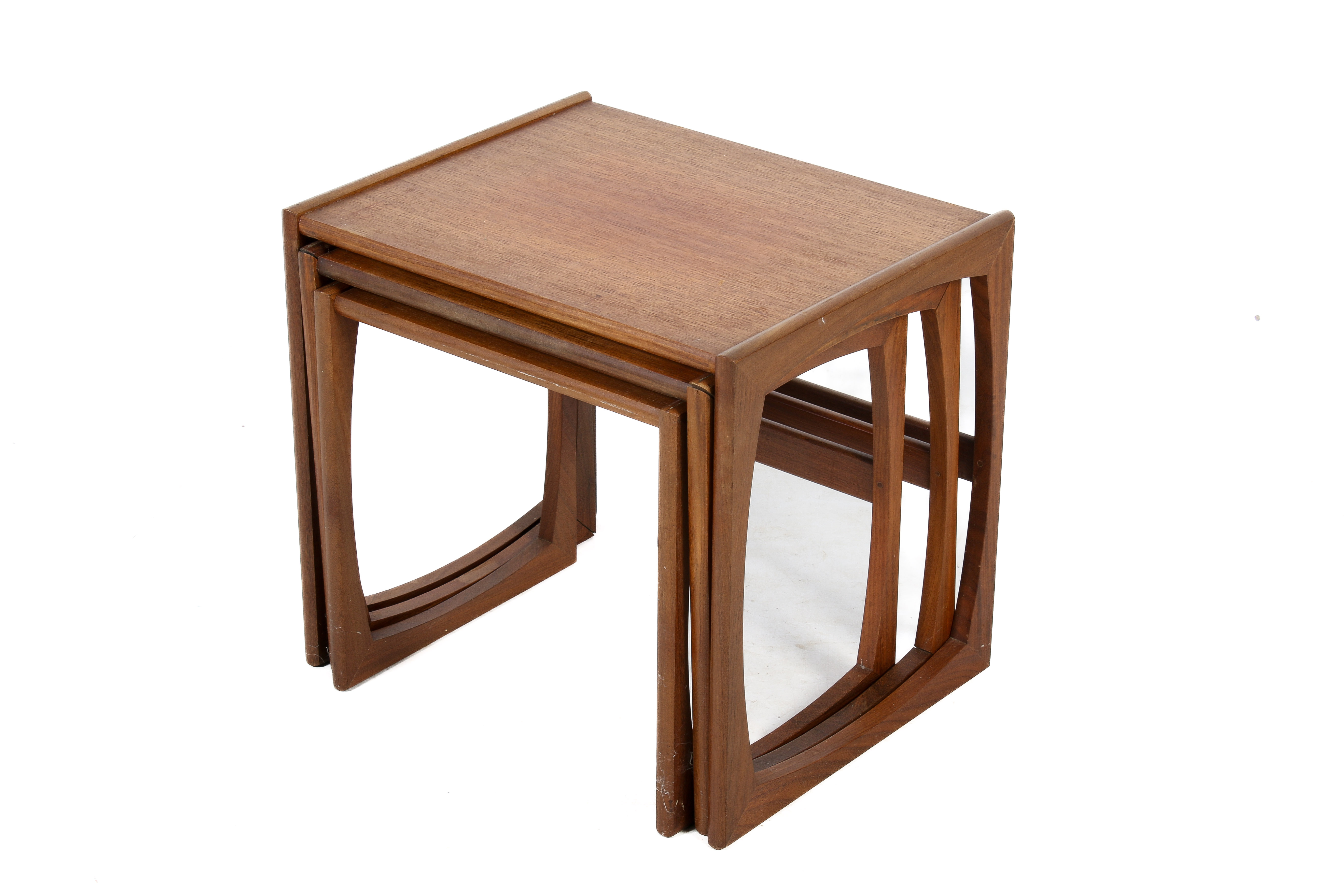 A mid-century teat nest of three tables.