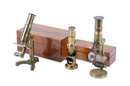 Three miniature antique field microscopes. Brass construction.