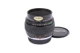 An Olympus OM 50mm f2 Zuiko Auto-Macro lens. Serial number 101578. With front and rear caps.