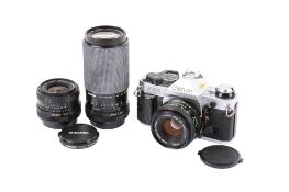 A Canon AE-1 Program 35mm SLR camera outfit. Chrome. Serial number 2770376.