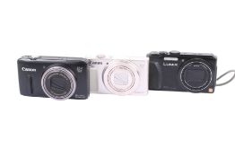 Three compact digital cameras.