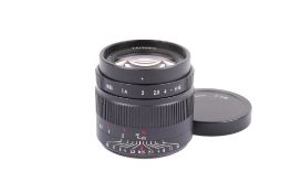 A 7Artisans 35mm f0.95 camera lens. Fuji X-mount. Serial number 23174. With front cap only.