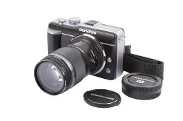 An Olympus Pen PL-1 Digital Mirrorless camera. With an Olympus M.Zuiko Digital ED 60mm f2.