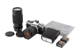 An Olympus OM-2 35mm SLR camera outfit. Chrome. Serial number 146953.