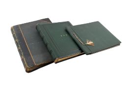 Three photograph albums.