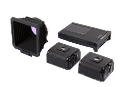 Three Hasselblad film backs and a lens hood.