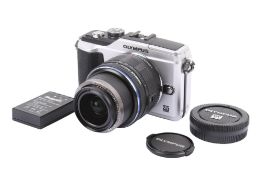 An Olympus Pen PL2 Digital Mirrorless camera. With an Olympus M.Zuiko Digital 14-42mm f3.5-5.
