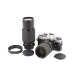 A Minolta XD7 35mm SLR camera outfit. Chrome. With two lenses; a Minolta MD Zoom 28-85mm f3.5-4.