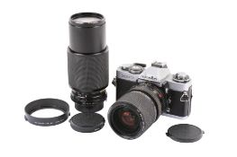 A Minolta XD7 35mm SLR camera outfit. Chrome. With two lenses; a Minolta MD Zoom 28-85mm f3.5-4.