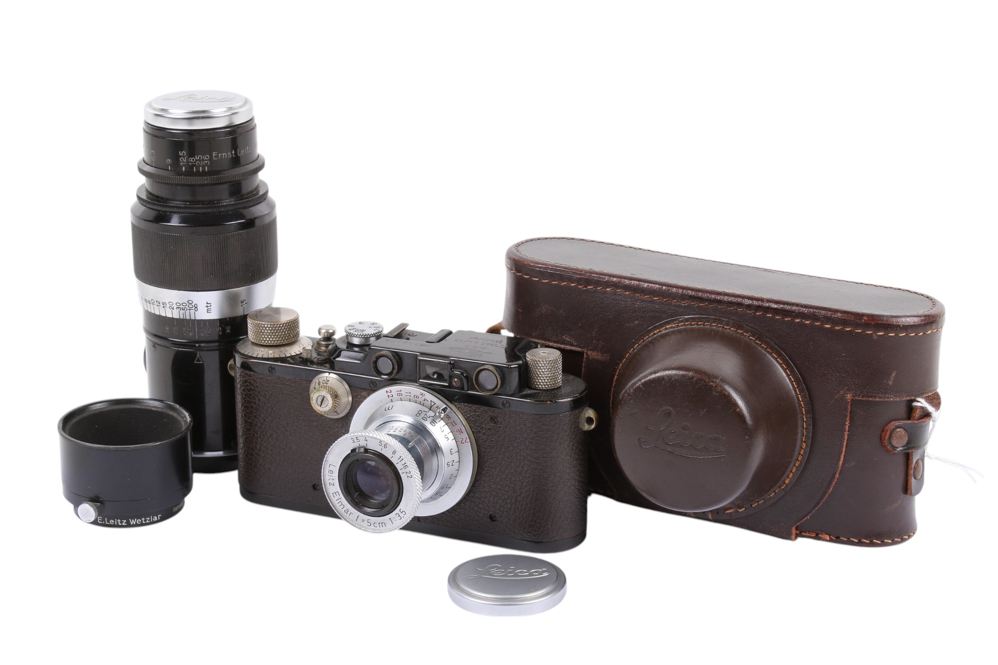 A Leitz Wetzlar Leica III 35mm Rangefinder camera outfit. Black and chrome body. 1934.