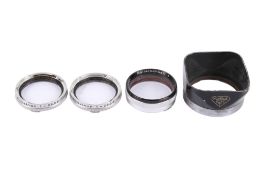 A set of Rolleinar-1 close-up filters and a lens hood.