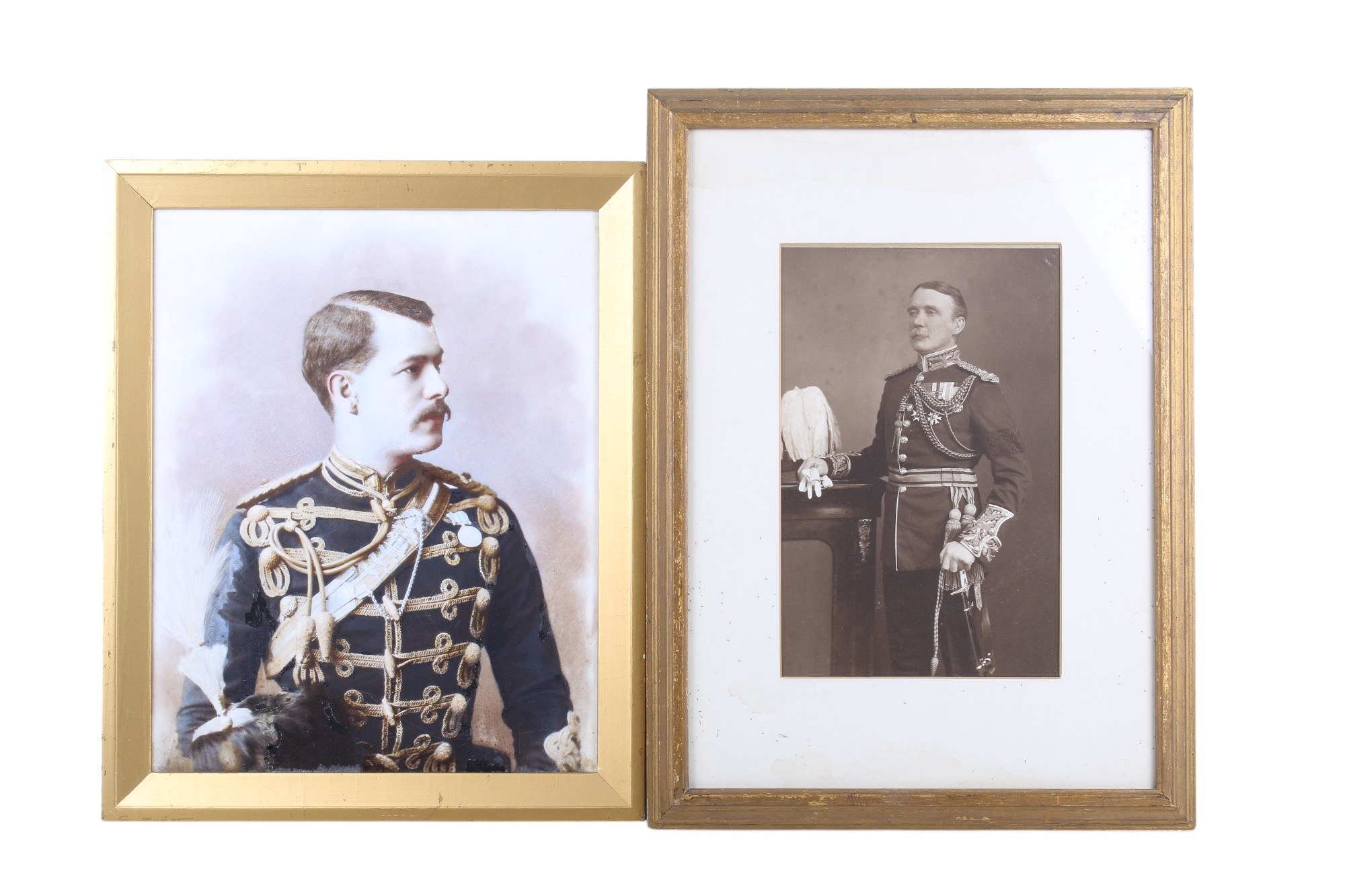 Two framed military portraits.