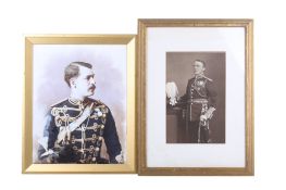 Two framed military portraits.