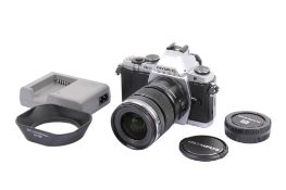 An Olympus OM-D E-M5 Digital Mirrorless camera. With an Olympus M.Zuiko Digital 12-50mm f3.5-6.