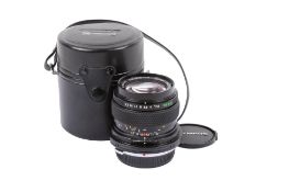 An Olympus OM 35mm f2.8 Zuiko Tilt Shift lens. Serial number 111837.