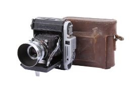 A Konishiroku Pearl 6 x 4.5 Medium Format Folding Rangefinder camera. With a Konishiroku 75mm f4.