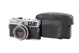 An Olympus 35 SP 35mm Rangefinder camera. Chrome. Serial number 313298. With an Olympus 42mm f1.7 G.