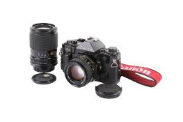 A Canon A-1 35mm SLR camera outfit. Black. Serial number 492842.