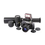 A Canon T70 35mm SLR camera outfit. Serial number 1278763.