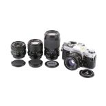 A Canon AE-1 35mm SLR camera outfit. Chrome. Serial Number 2945081.
