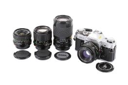 A Canon AE-1 35mm SLR camera outfit. Chrome. Serial Number 2945081.