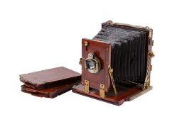 An antique brass and mahogany H. Park half-plate camera.