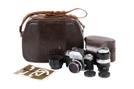 A Nikon F Photomic T 35mm SLR camera outfit. Chrome. Serial number 6772455.