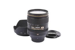 A Nikon AF-S Nikkor 24-120mm f4 G ED VR lens. With lens hood front and rear caps.