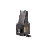 An unbranded reflex plate camera. Makers plate appears to have been removed.