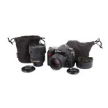 A Nikon D7000 Digital SLR camera outfit. With two lenses; an AF-S Nikkor 50mm f1.