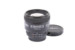 A Nikon AF Nikkor 85mm f1.8 D lens. With Skylight(1B) filter, front and rear caps.