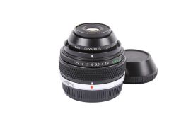 An Olympus OM 38mm f2.8 Zuiko Auto-Macro lens. Serial number 103517. With front and rear caps.