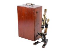 An unbranded antique brass monocular microscope. No visible makers marks. Stamped 'U.L 9'.