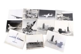 A collection of black and white photographic prints of international aircraft and submarines.