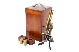 A Henry Crouch London brass monocular microscope. Serial number 8596. With No.