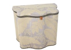 A fabric covered serpentine laundry basket. Having a padded seat.