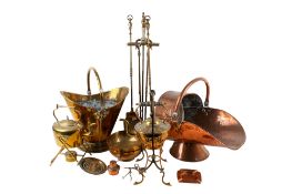 A large collection of brass and coppers fire side items.