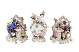 Three 20th century Dresden style porcelain figures. Including a pair of couple groups, etc. Max.